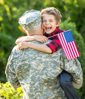 military veteran hugs family member